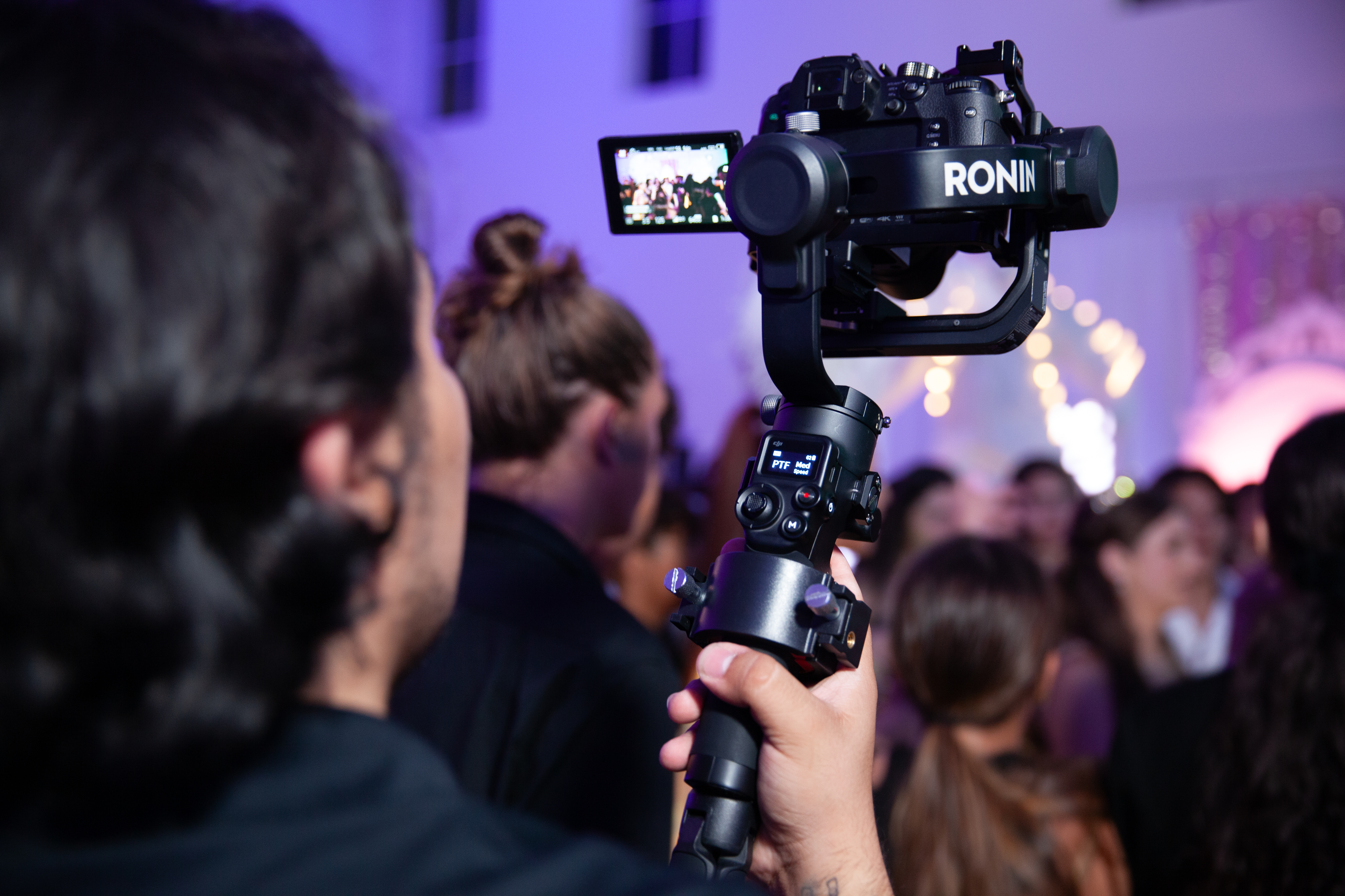 Camera and gimbal coverage during a quinceanera event.