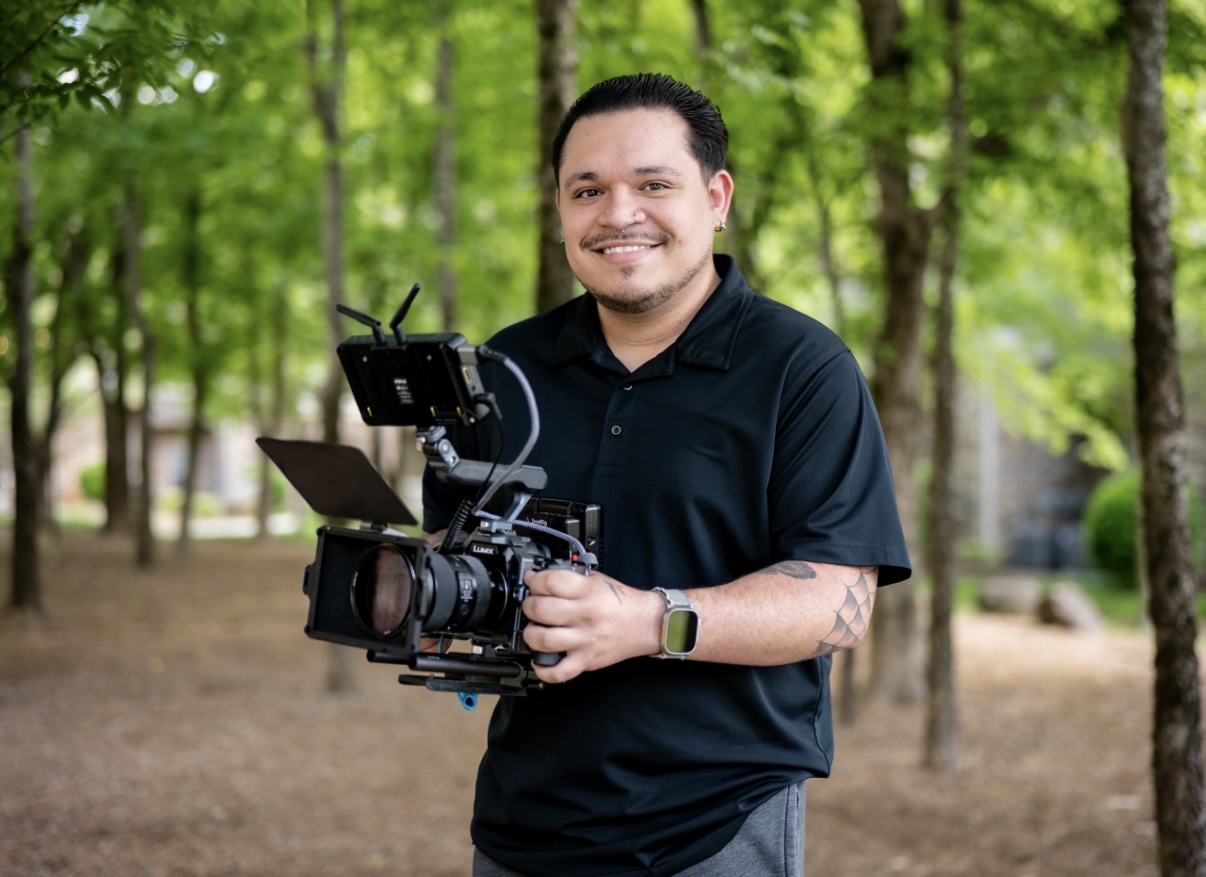 Jeremy Arana on location with a cinema camera.